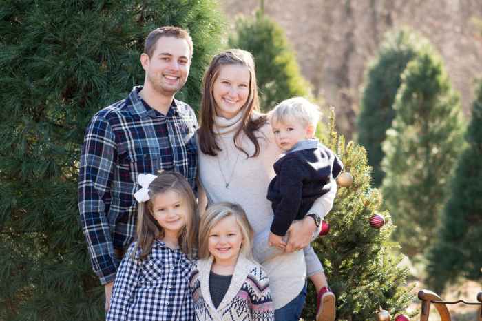 photography of family near pine tree